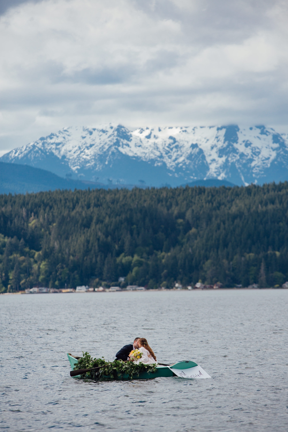 bride-and-groom-kissing-in-wedding-getaway-boat