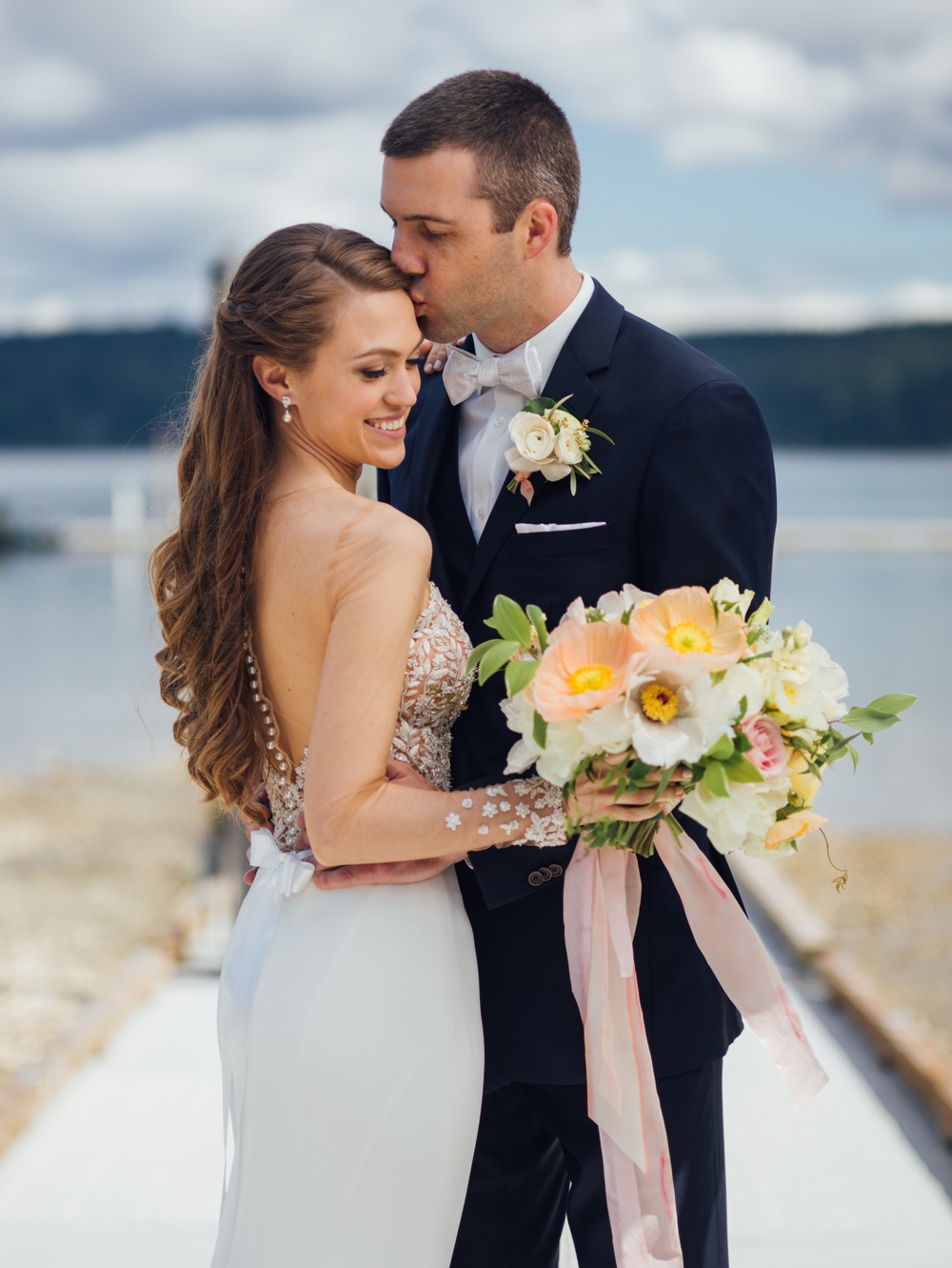 bride-and-groom-on-dock-at-alderbrook