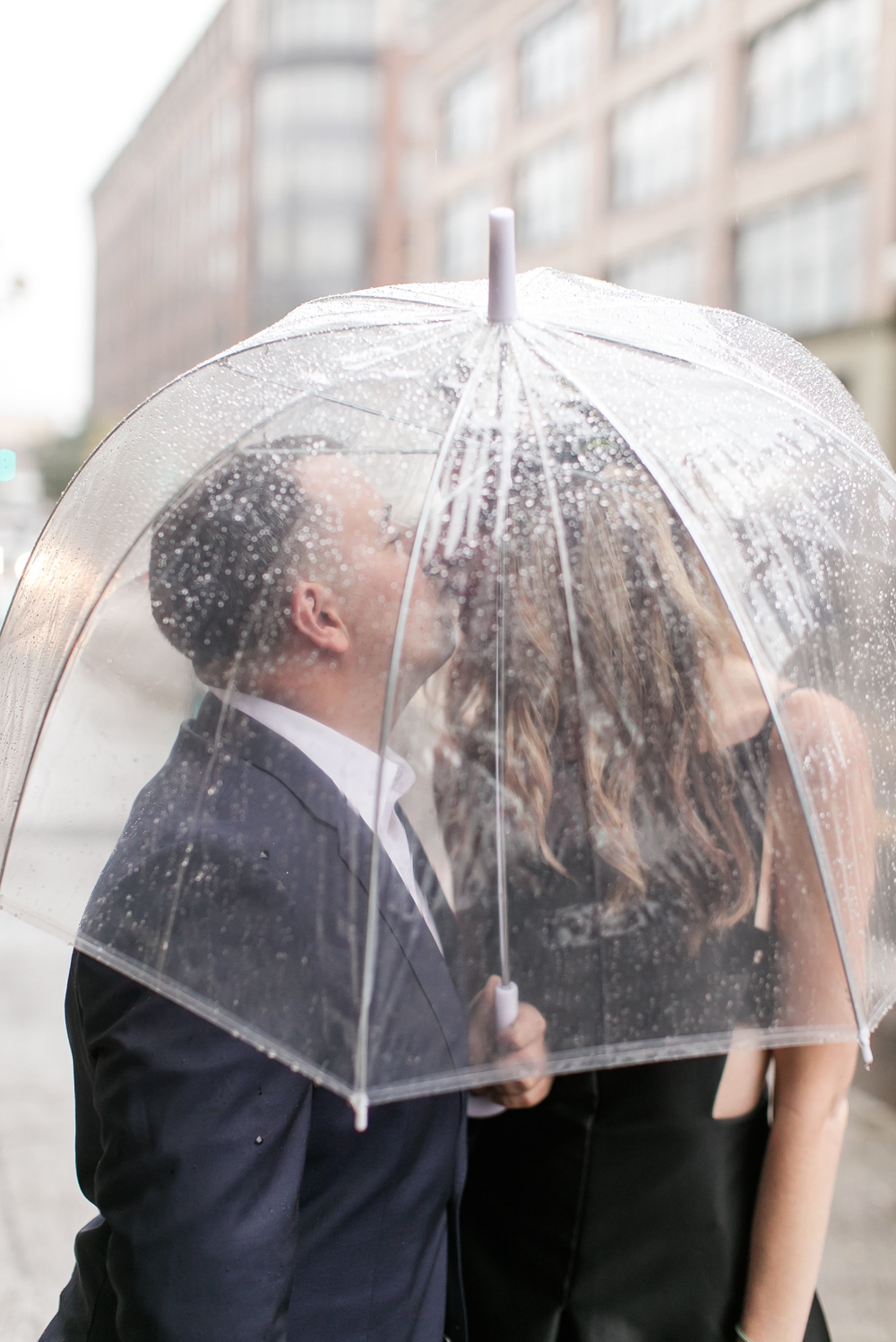 kiss-under-clear-umbrella