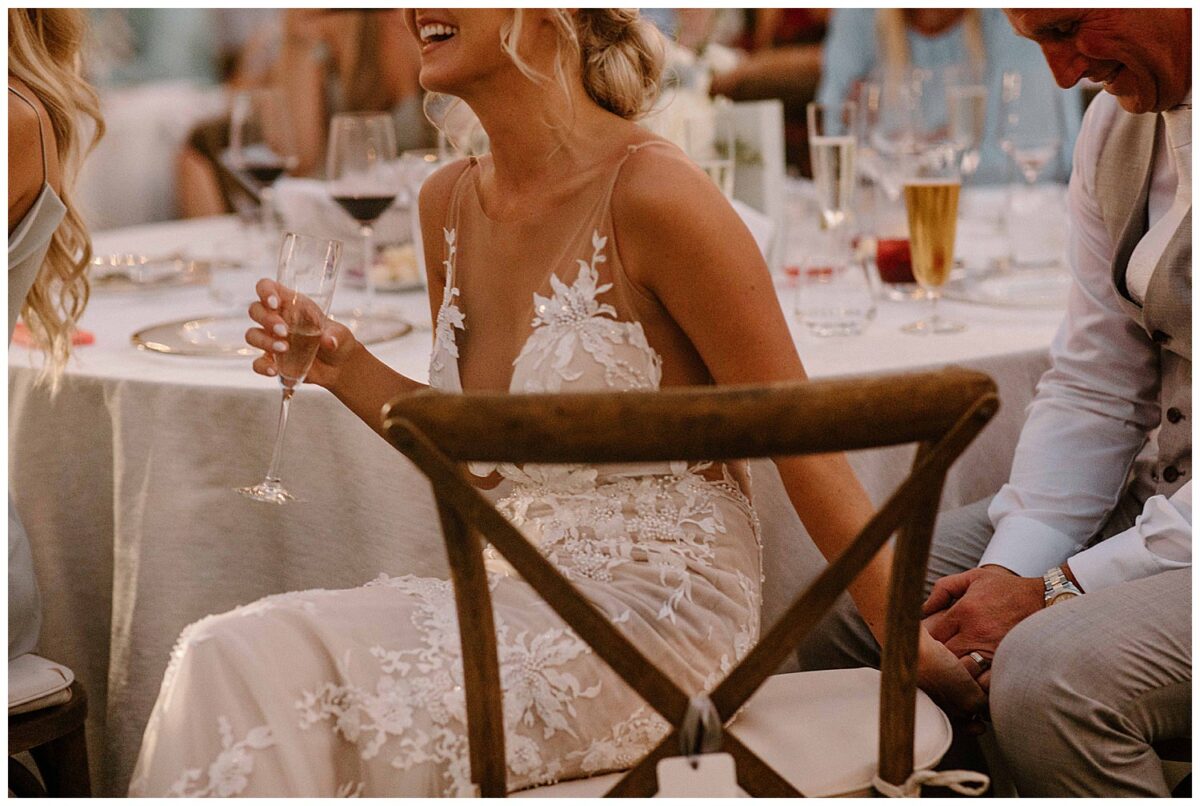 bride and groom holding hands 